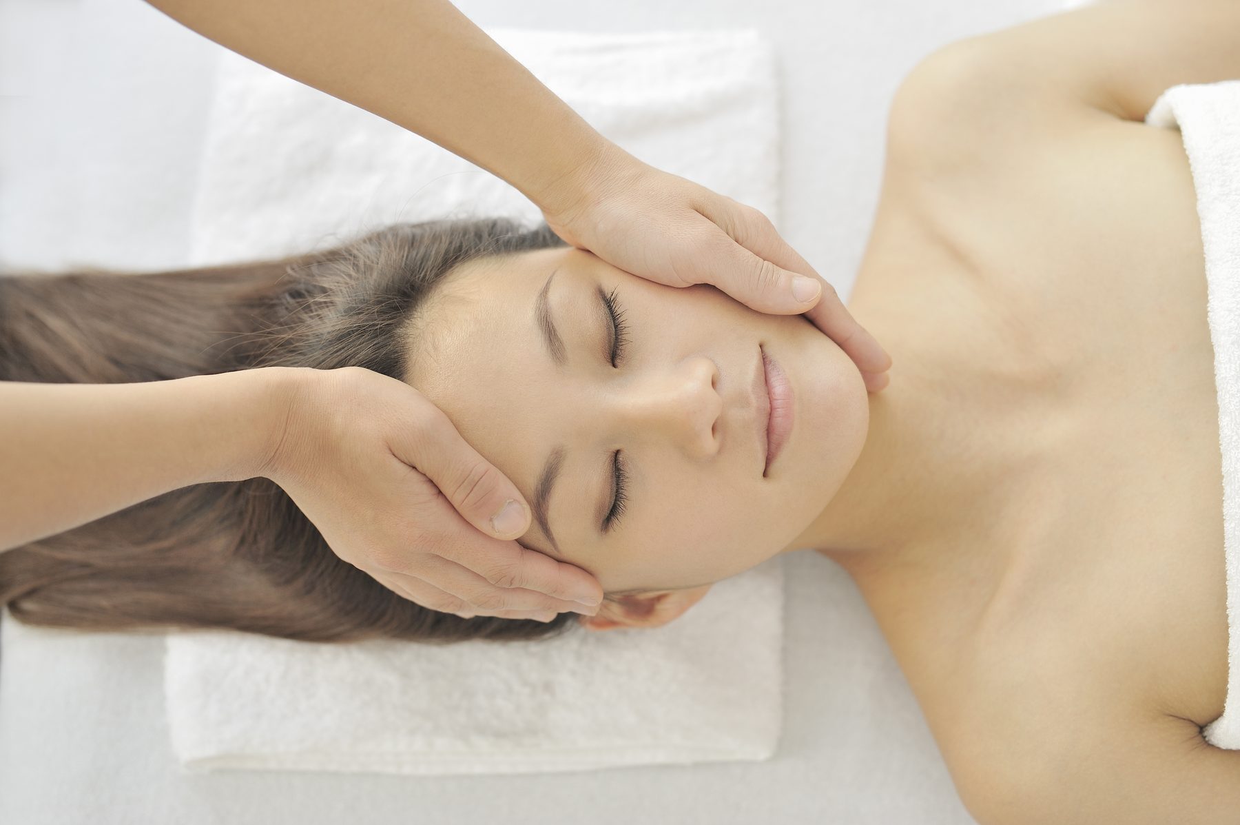 Facial massage during a private group girls day spa treatment in Orlando