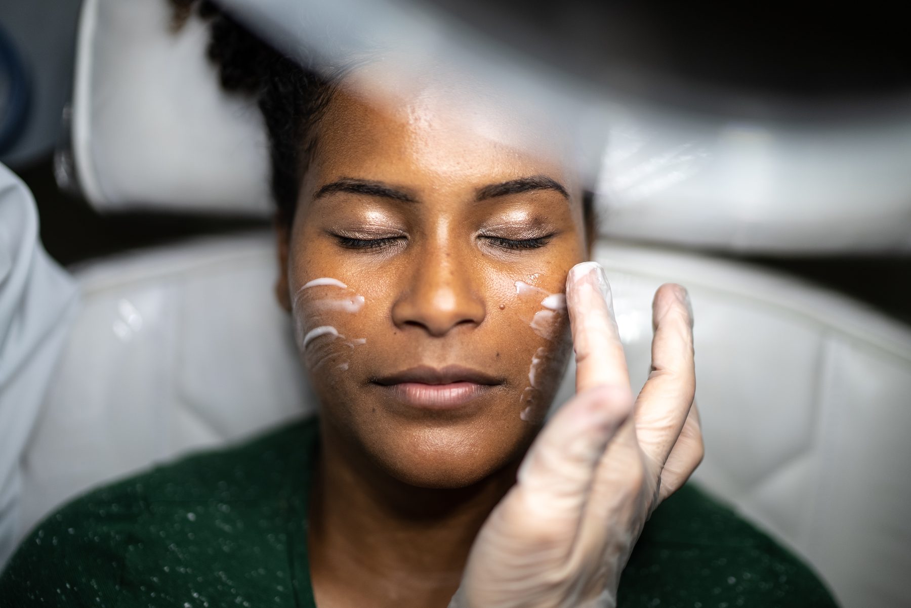 Signature custom facial treatment with hydrating serum applied during a private in-home appointment in Orlando
