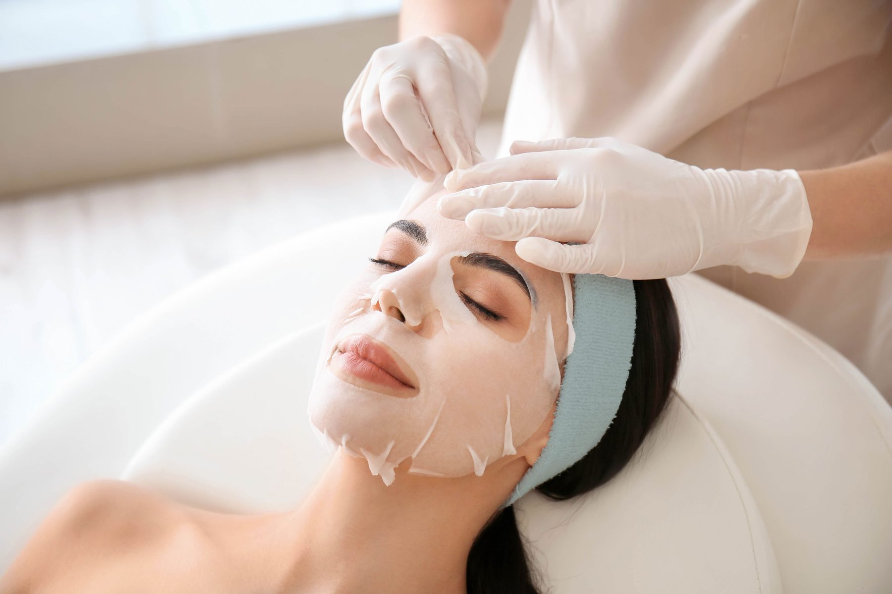 Korean facial with microcurrent and red light therapy performed by a Perla Esthetics esthetician in Orlando, Florida